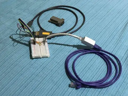 RJ45-DB9 adapter wired on breadboard