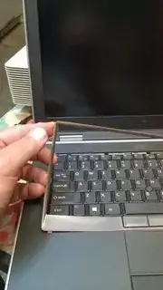 Lifting out the keyboard border ring